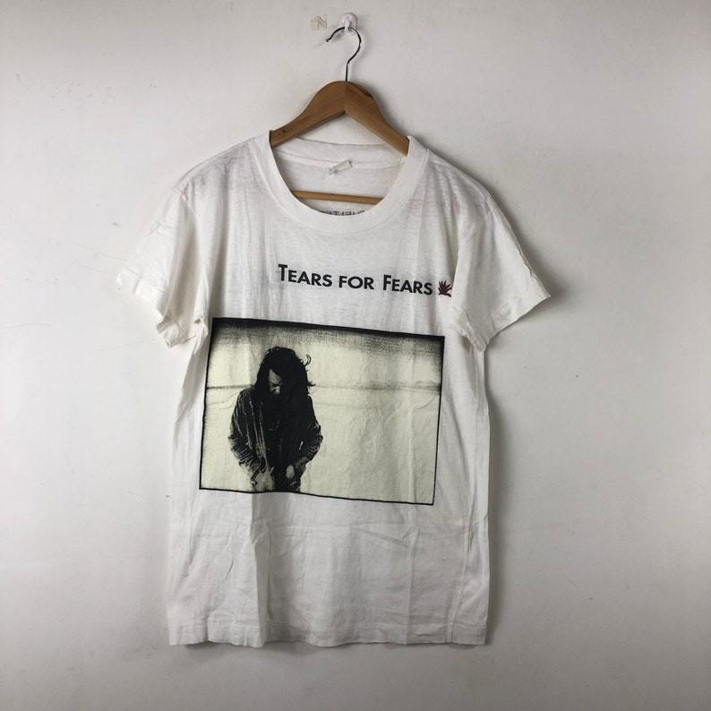 Vintage 90s Tears For Fears TShirt Rare Elemental Tour Tee S5XL PA6920 Unisex T-Shirt XXXXL
Vintage 90s Tears For Fears TShirt Rare Elemental Tour Tee S5XL PA6920 Unisex T-Shirt XXXXL