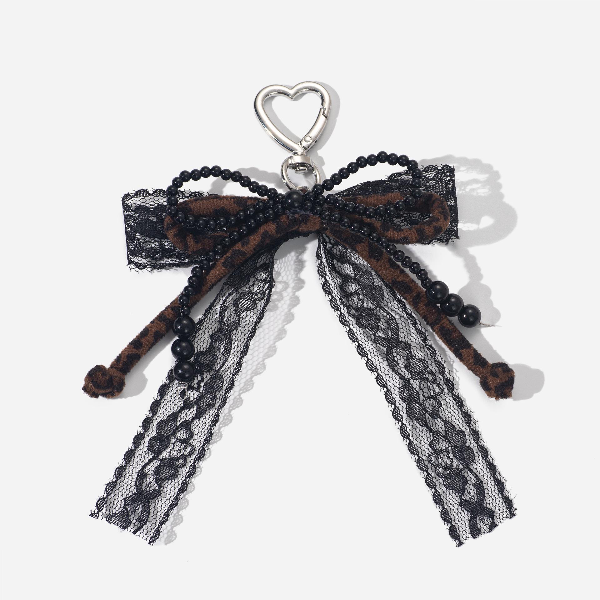Leopard Print Braided Cord Keychain with Bow and Beads Black Beaded - 1 piece
Leopard Print Braided Cord Keychain with Bow and Beads Black Beaded - 1 piece