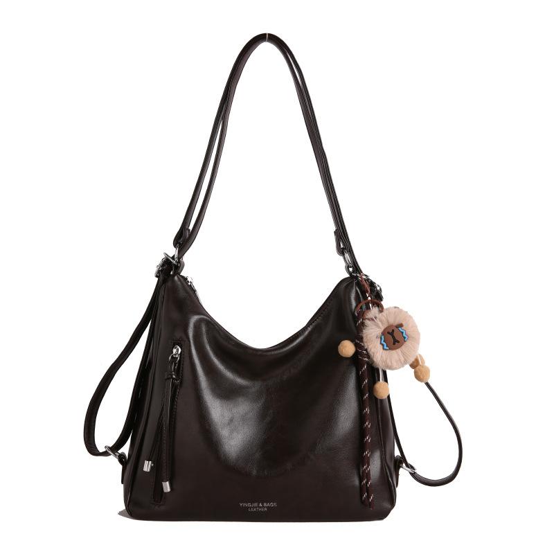 Retro backpack, new single shoulder fashion commuter tote messenger bag, casual large capacity portable versatile tide темно-коричневого кольору
Retro backpack, new single shoulder fashion commuter tote messenger bag, casual large capacity portable versatile tide темно-коричневого кольору
