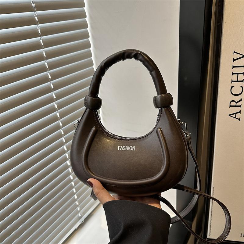 Niche design sense retro fashion portable small bag women 2025 spring new Maillard shoulder armpit bag
Niche design sense retro fashion portable small bag women 2025 spring new Maillard shoulder armpit bag