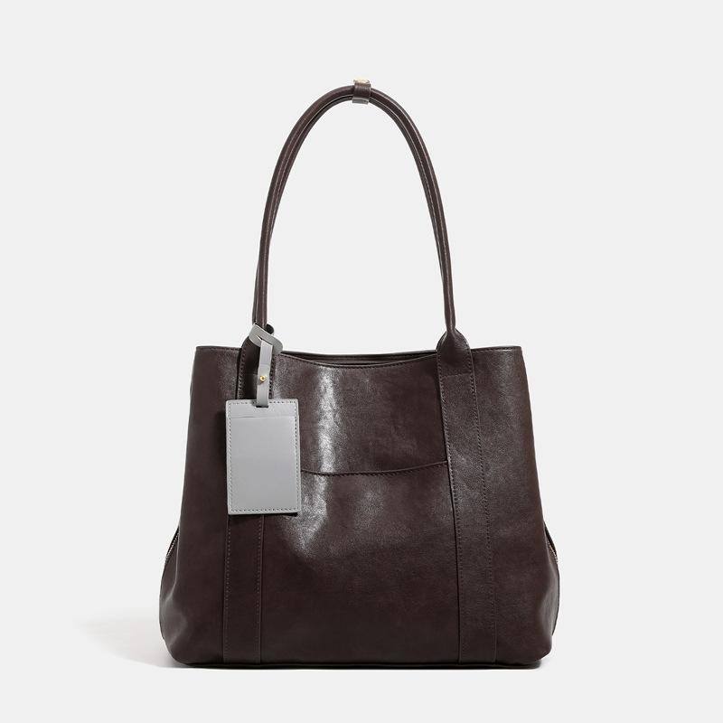 Large Capacity Retro Tote Bag, New Super Popular Commuting Single Shoulder Armpit Simple Multi Pocket Large Bag темно-коричневого кольору
Large Capacity Retro Tote Bag, New Super Popular Commuting Single Shoulder Armpit Simple Multi Pocket Large Bag темно-коричневого кольору