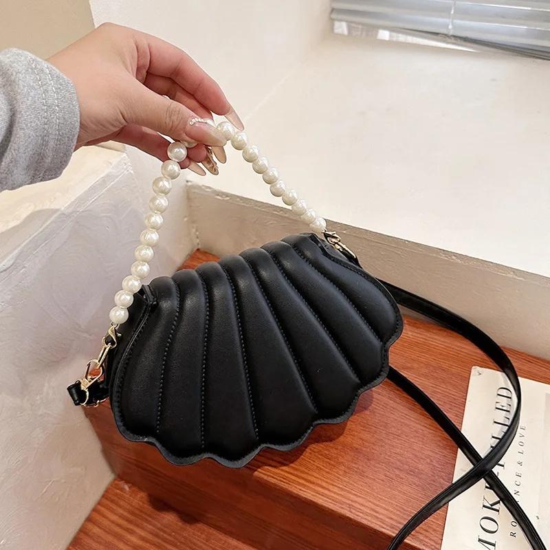 Durable Cute Shell Shoulder Bag Minimalist with Pearls Design Crossbody Bag PU Leather Pearl Decorated Handbag for Women Girls
Durable Cute Shell Shoulder Bag Minimalist with Pearls Design Crossbody Bag PU Leather Pearl Decorated Handbag for Women Girls