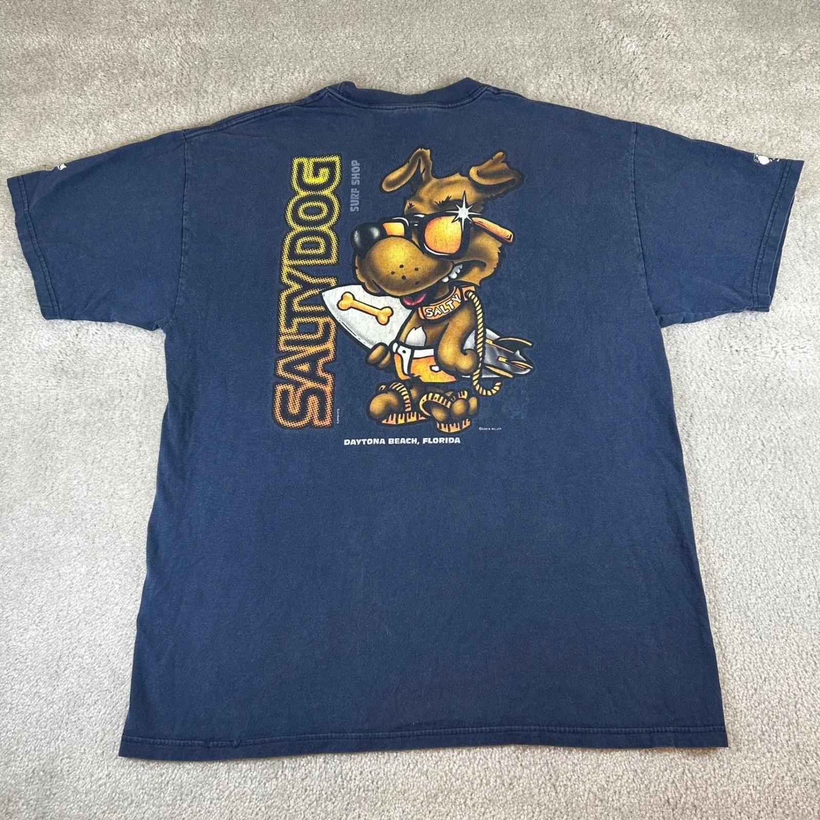 Vintage 90s Salty Dog Surf Shop Daytona Beach T-shirt Navy Hanes Beefy-T Large 2XL
Vintage 90s Salty Dog Surf Shop Daytona Beach T-shirt Navy Hanes Beefy-T Large 2XL