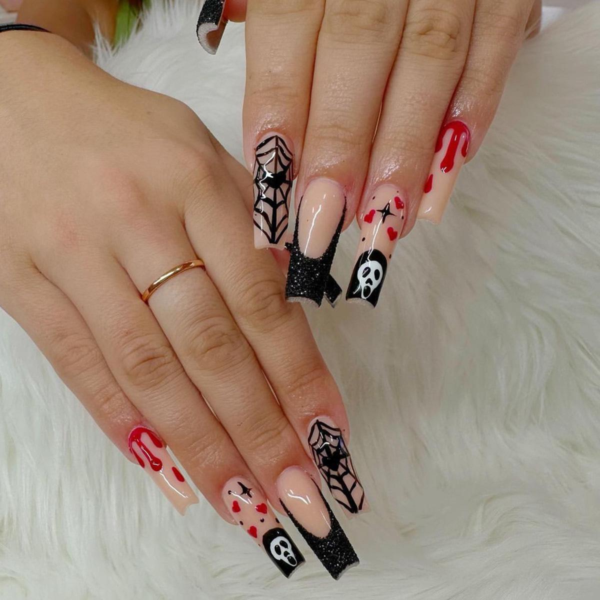 Wearable Halloween Nail Art: Long Pipe Nails with Stars, Hearts, Ghosts, and Spider Webs.
Wearable Halloween Nail Art: Long Pipe Nails with Stars, Hearts, Ghosts, and Spider Webs.