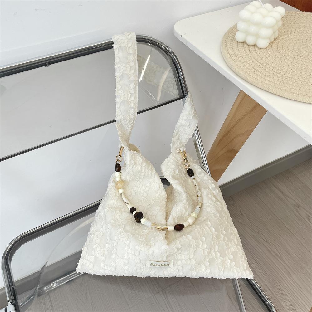 Design sense jacquard vest bag three-dimensional small flower beaded armpit bag female student shoulder bag
Design sense jacquard vest bag three-dimensional small flower beaded armpit bag female student shoulder bag
