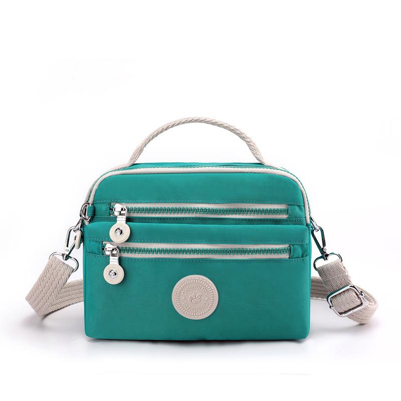New women s fashion trend shoulder bag simple contrasting color messenger bag nylon mobile phone change bag
New women s fashion trend shoulder bag simple contrasting color messenger bag nylon mobile phone change bag