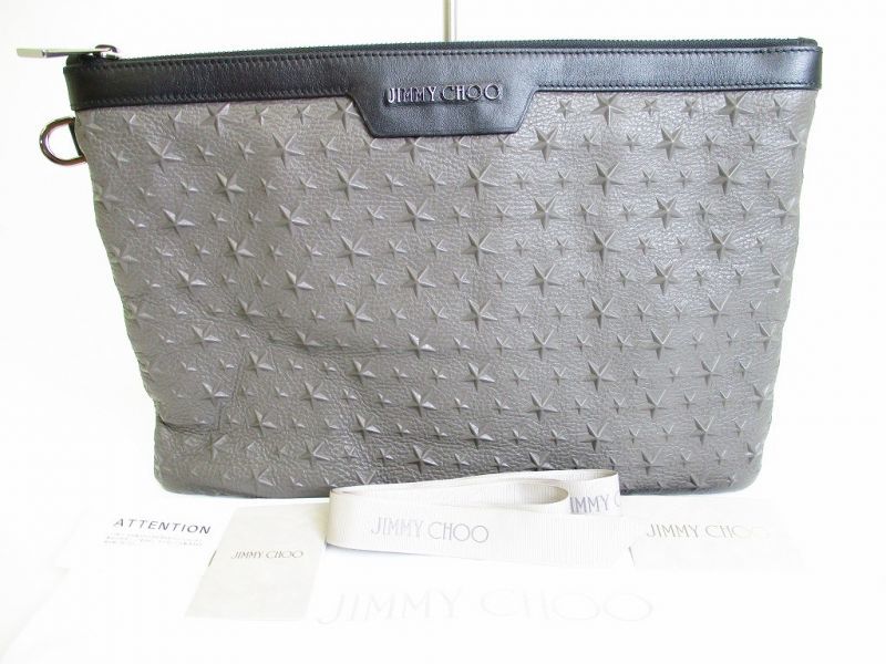 Автентичний сіро-чорний шкіряний клатч Jimmy Choo з тисненням зірок №8059 відремонтований
Автентичний сіро-чорний шкіряний клатч Jimmy Choo з тисненням зірок №8059 відремонтований