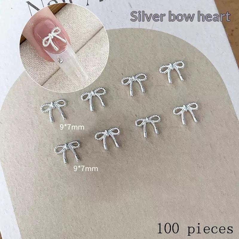 Nail Decoration 100Pcs 3D Silver Small Bowkont Heart-shaped Ornaments for DIY Stylish Manicure
Nail Decoration 100Pcs 3D Silver Small Bowkont Heart-shaped Ornaments for DIY Stylish Manicure