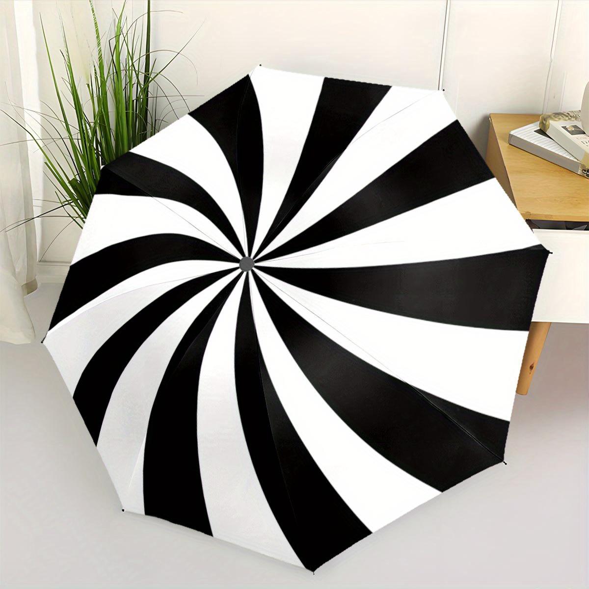 A Black And White Spiral Patterned Automatic Folding Umbrella. It Features a Portable And Collapsible Design, Making It a Casual Outdoor Acc
A Black And White Spiral Patterned Automatic Folding Umbrella. It Features a Portable And Collapsible Design, Making It a Casual Outdoor Acc