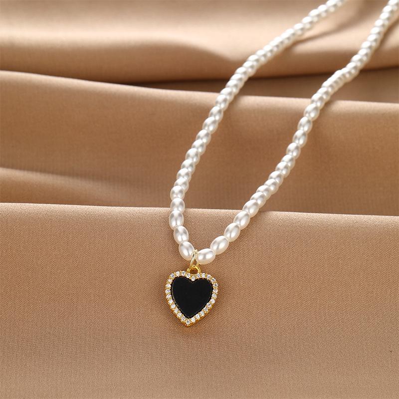 Black And White Double-Sided Love Pearl Necklace Women S Light Luxury Design Sense Simple And Non-Fading Heart-Shaped Pendant Jewelry
Black And White Double-Sided Love Pearl Necklace Women S Light Luxury Design Sense Simple And Non-Fading Heart-Shaped Pendant Jewelry