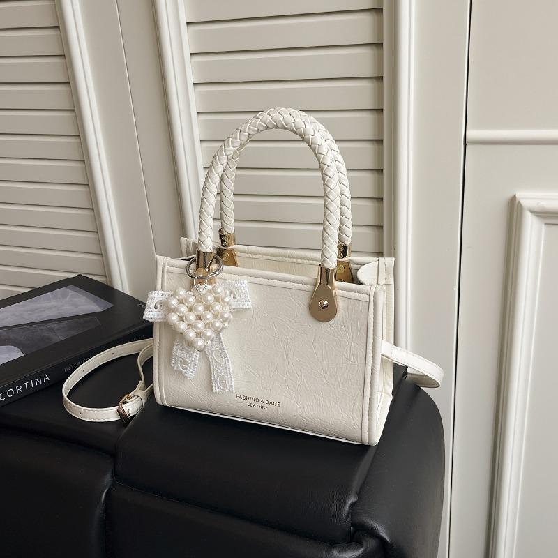 The Stylish Crossbody Bag Is Currently in Fashion, Along with Small Square Handbags. With pendant белый
The Stylish Crossbody Bag Is Currently in Fashion, Along with Small Square Handbags. With pendant белый
