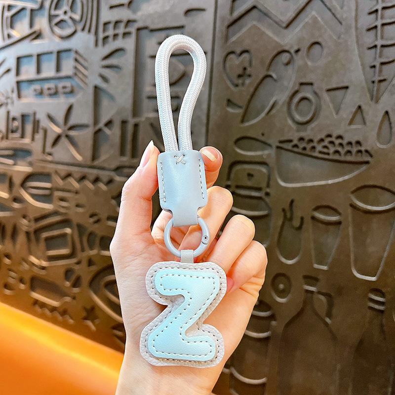 Creative leather English alphabet keychain dopamine bag pendant trinket accessories gift car key chain
Creative leather English alphabet keychain dopamine bag pendant trinket accessories gift car key chain