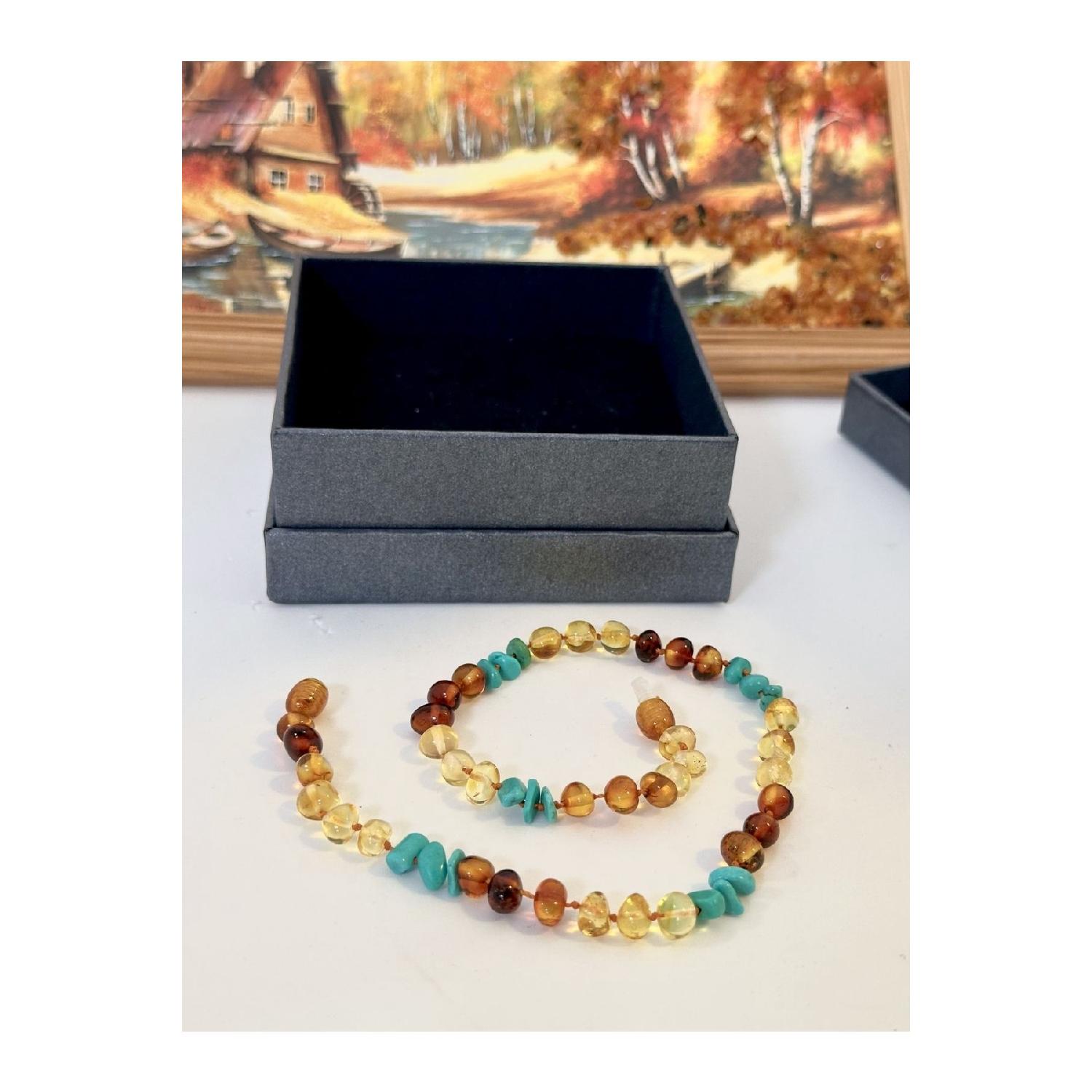 Сертифіковане оригінальне намисто з бірюзовим камінням Drop Amber із молочними зубами 32 - 34 cm
Сертифіковане оригінальне намисто з бірюзовим камінням Drop Amber із молочними зубами 32 - 34 cm