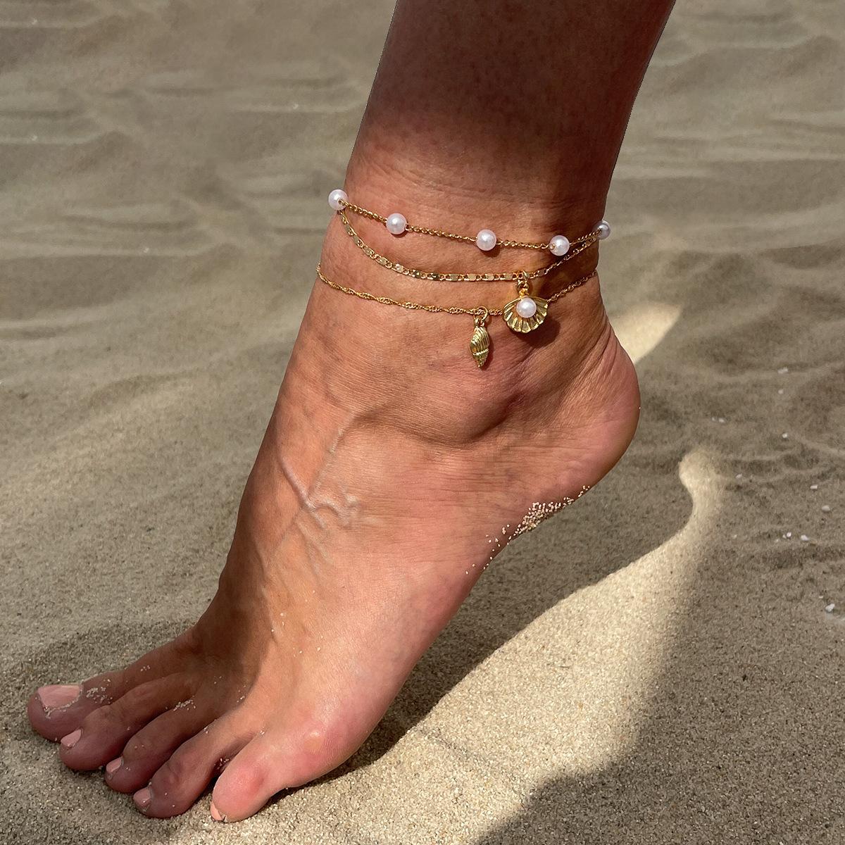 Simple thin chain stacked with imitation pearl foot jewelry, ocean vacation style starfish conch anklet women
Simple thin chain stacked with imitation pearl foot jewelry, ocean vacation style starfish conch anklet women