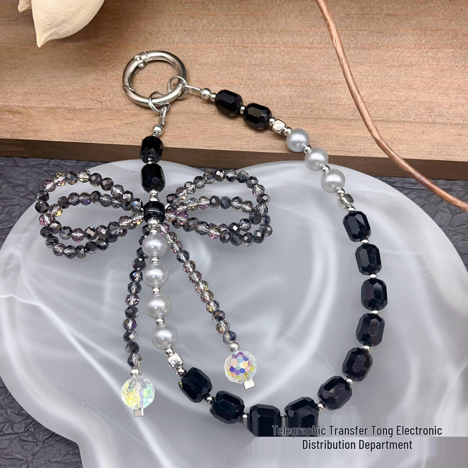 Elegant Crystal Bowknot Phone Case Lanyard with Pearl Beaded Wrist Strap for Women
Elegant Crystal Bowknot Phone Case Lanyard with Pearl Beaded Wrist Strap for Women