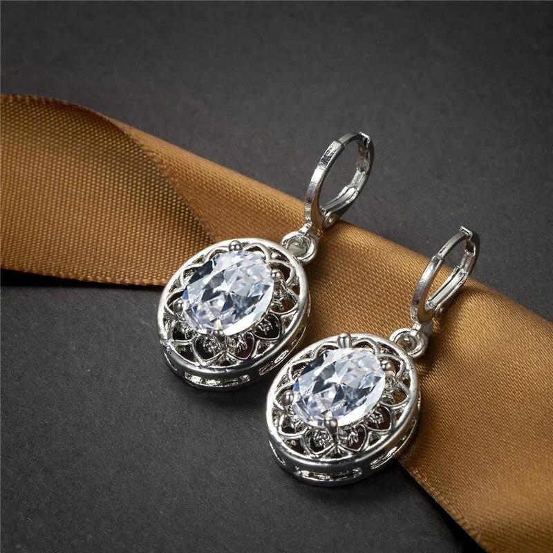 Роскошные серьги-кольца с кристаллами и радужным камнем, классические серебряные обручальные серьги, изящные овальные серьги с цветком из циркона для женщин
Роскошные серьги-кольца с кристаллами и радужным камнем, классические серебряные обручальные серьги, изящные овальные серьги с цветком из циркона для женщин