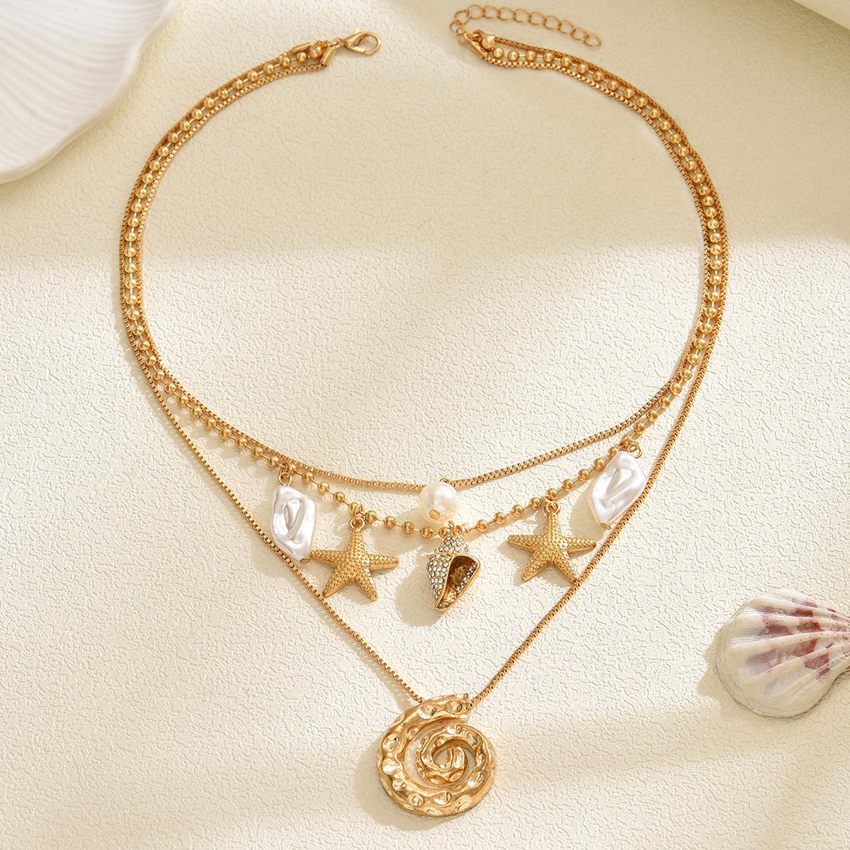 Seaside shell necklace, European and American beach starfish irregular spiral pendant, stacked on top of each other, wearing holiday style necklaces
Seaside shell necklace, European and American beach starfish irregular spiral pendant, stacked on top of each other, wearing holiday style necklaces