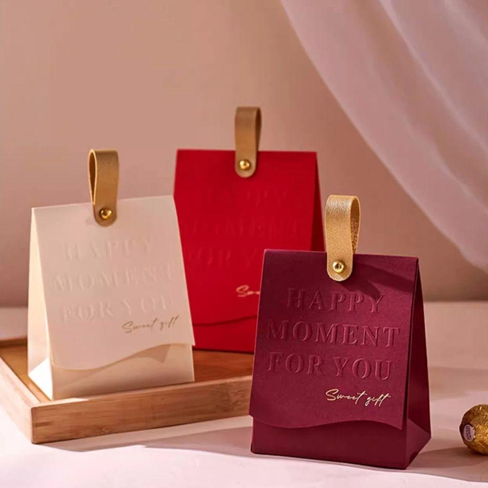 Creative Gift Packaging Box Mini Handle Bag Embossed Printing Candy Box Candy Chocolate Biscuit
Creative Gift Packaging Box Mini Handle Bag Embossed Printing Candy Box Candy Chocolate Biscuit
