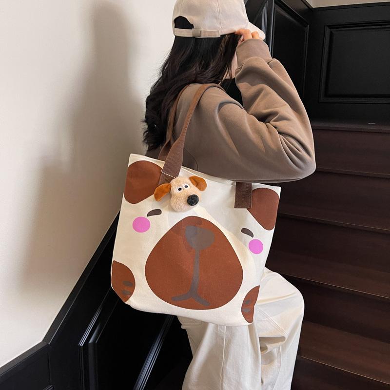 Новая летняя большая вместительная сумка-тоут с мультяшным принтом животных, милая модная сумка через плечо
Новая летняя большая вместительная сумка-тоут с мультяшным принтом животных, милая модная сумка через плечо