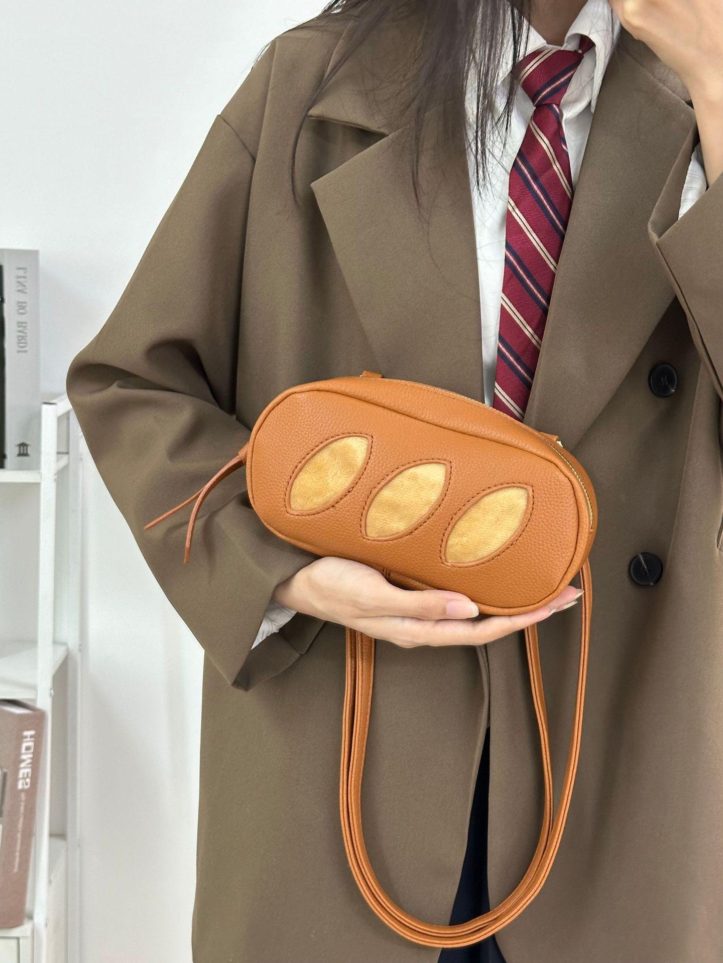 2025 new niche design handmade cosmetic bag shoulder messenger bag bag cute personality creative bread storage bag коричневий
2025 new niche design handmade cosmetic bag shoulder messenger bag bag cute personality creative bread storage bag коричневий