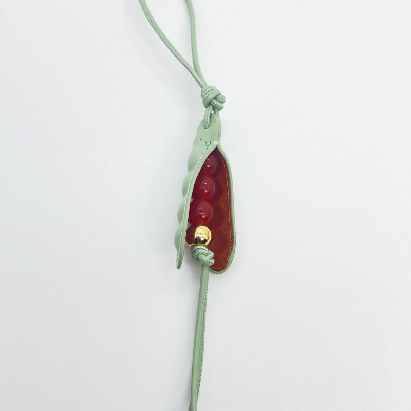 Premium Leather Lo Jia Pea Pod Bag Charm Keychain.
Premium Leather Lo Jia Pea Pod Bag Charm Keychain.