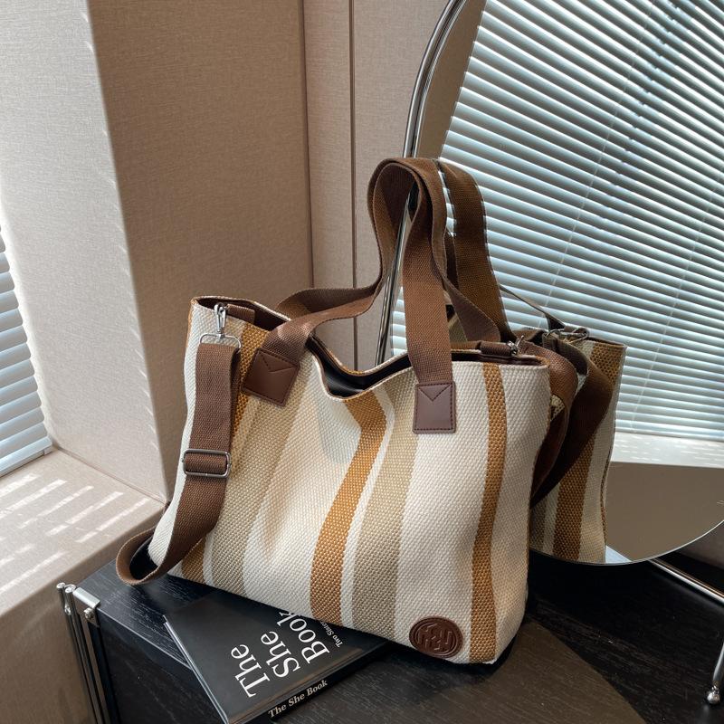 Large capacity striped bag women s new cloth bag fashion casual class bag contrasting color shoulder messenger bag
Large capacity striped bag women s new cloth bag fashion casual class bag contrasting color shoulder messenger bag