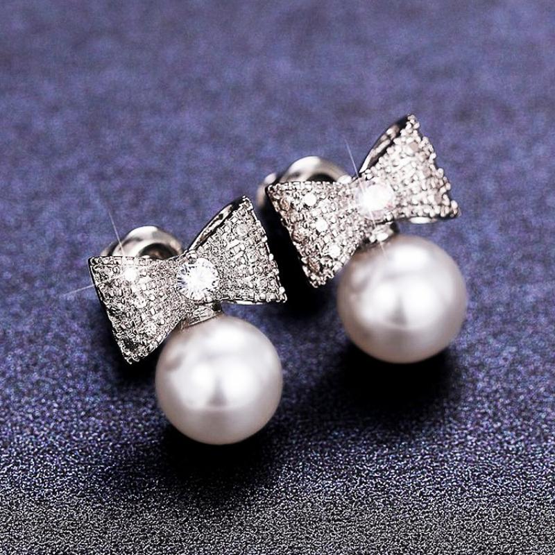 Huitan Dainty Women s Stud Earrings Bow Shape with Simulated Pearl Fashion Contracted Ear Accessories Wedding Statement Zircon
Huitan Dainty Women s Stud Earrings Bow Shape with Simulated Pearl Fashion Contracted Ear Accessories Wedding Statement Zircon