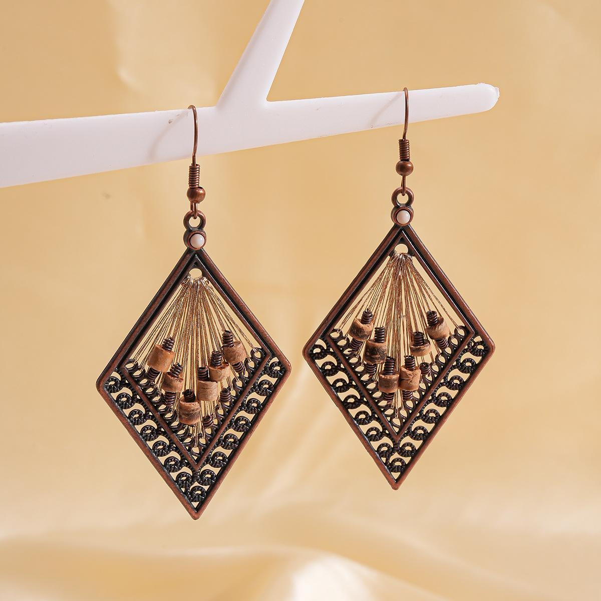 Coconut Shell Beaded Hollow Rhombus Ear Hook Maillard High-end Earrings for Women золотий
Coconut Shell Beaded Hollow Rhombus Ear Hook Maillard High-end Earrings for Women золотий