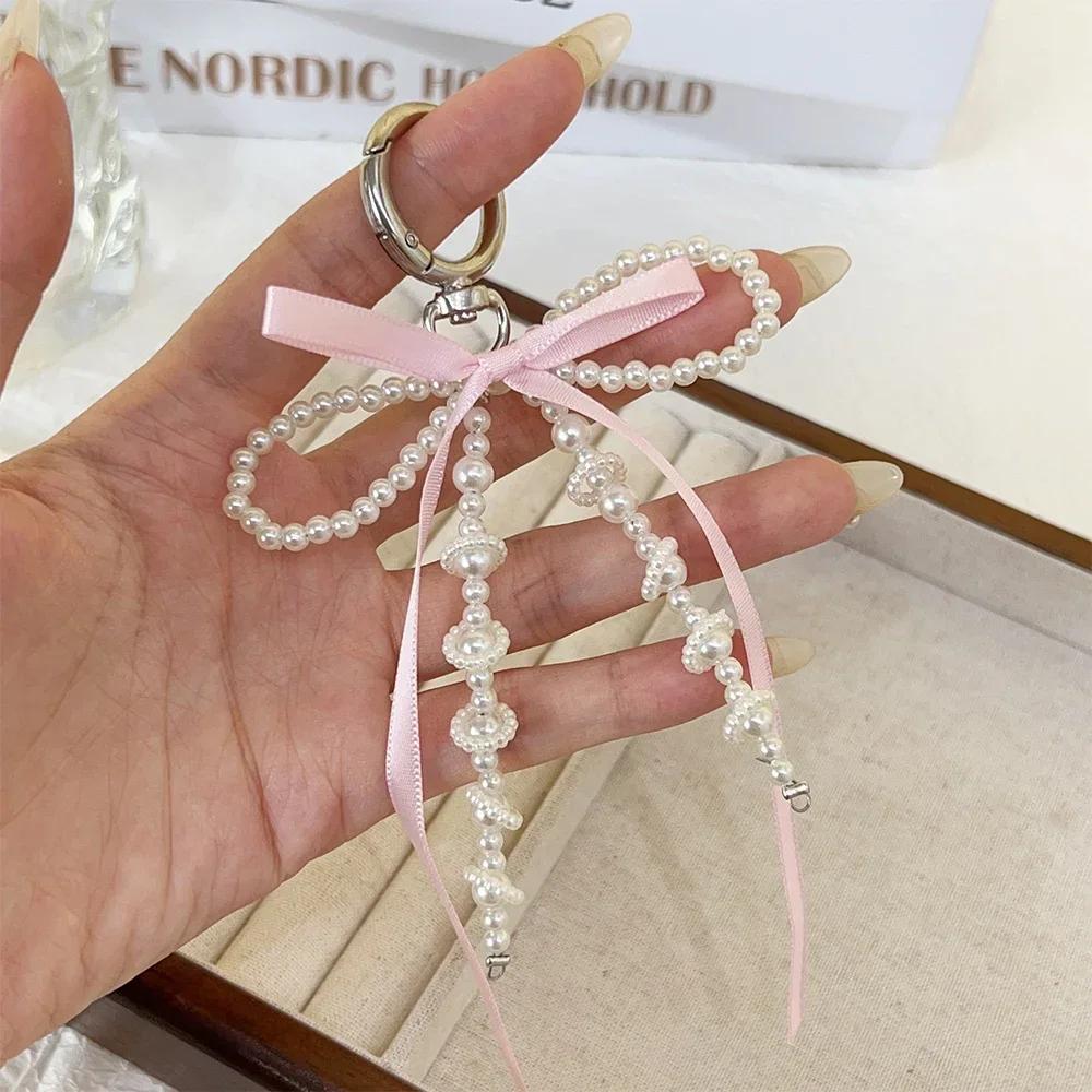 2026 New Korean Fashion Sweet Pearl Bow Keychain Phone Pendant Keyring Y2K Ins Aesthetic Holder for Girl Bag Pendant Accessories
2026 New Korean Fashion Sweet Pearl Bow Keychain Phone Pendant Keyring Y2K Ins Aesthetic Holder for Girl Bag Pendant Accessories