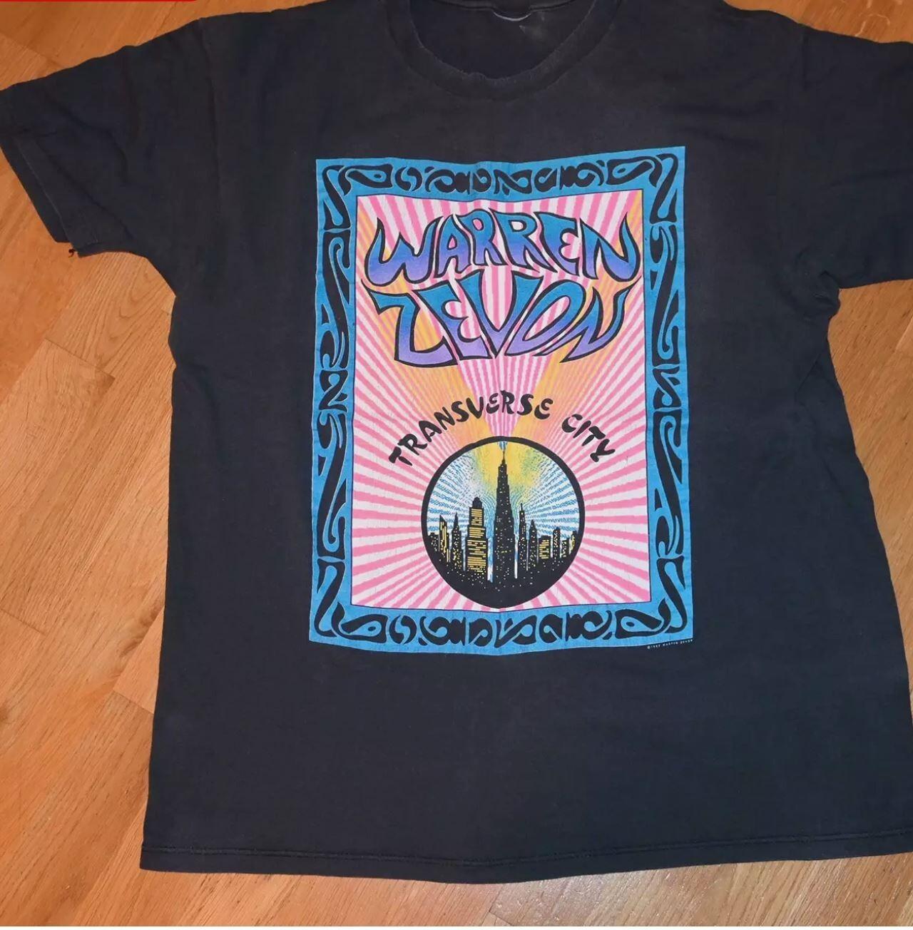 1980 Warren Zevon Футболка с коротким рукавом Подарок для фаната от S до 4XL 3XL
1980 Warren Zevon Футболка с коротким рукавом Подарок для фаната от S до 4XL 3XL