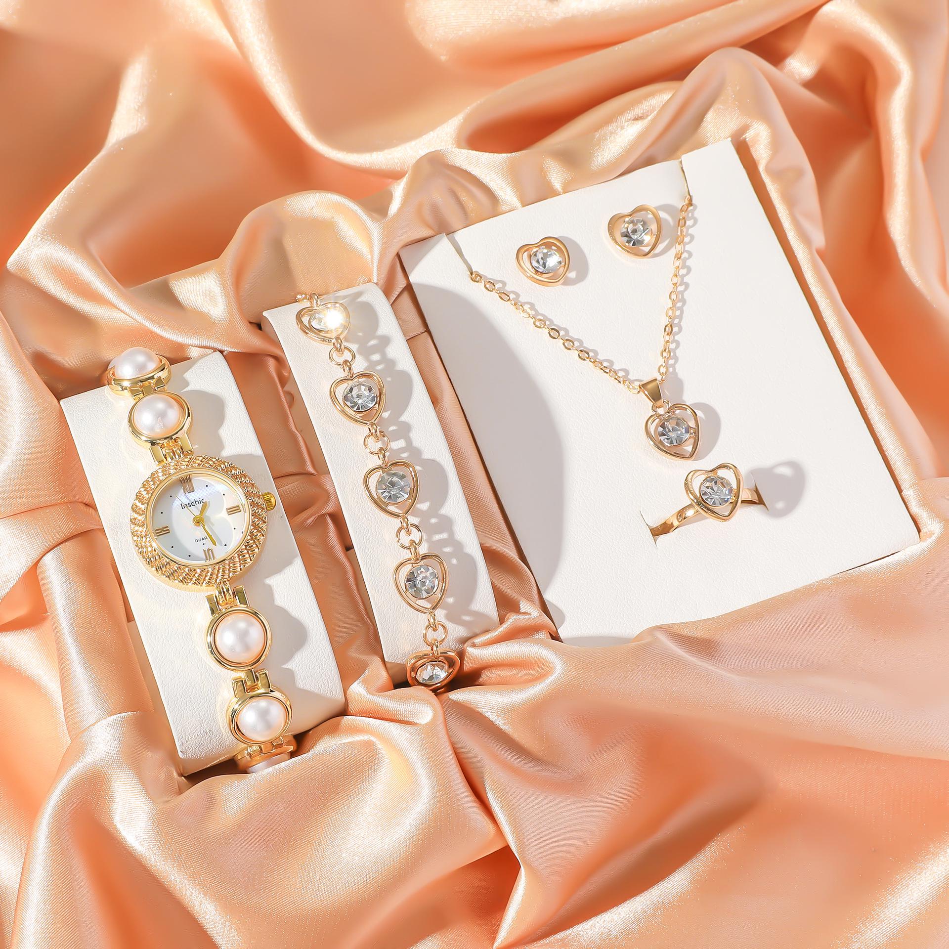 Женский стильный жемчужный набор часов и украшений: Браслет, Ожерелье, Серьги, Кольцо
Женский стильный жемчужный набор часов и украшений: Браслет, Ожерелье, Серьги, Кольцо