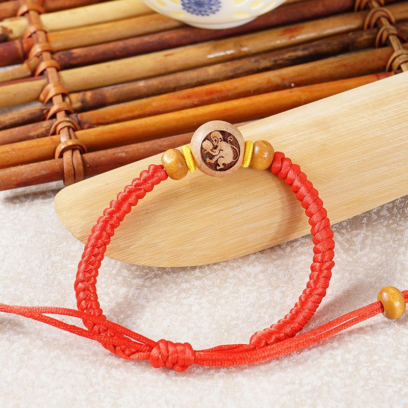 Peach Wood Carved Zodiac Bead Bracelet with Red String
Peach Wood Carved Zodiac Bead Bracelet with Red String