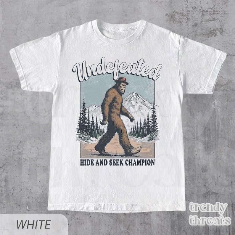Funny Bigfoot Shirt Undefeated Hide And Seek Champion T Shirt Full Size S3XL Unisex T-Shirt S
Funny Bigfoot Shirt Undefeated Hide And Seek Champion T Shirt Full Size S3XL Unisex T-Shirt S