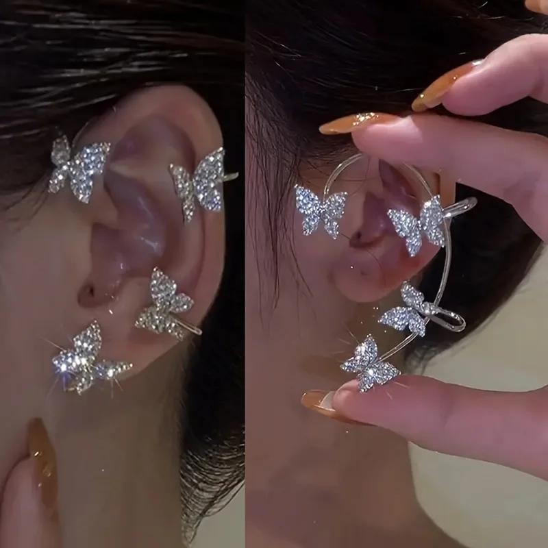 Women s butterfly earring set, including ear cuffs, earring backs, and climbing wrap-around earrings.
Women s butterfly earring set, including ear cuffs, earring backs, and climbing wrap-around earrings.