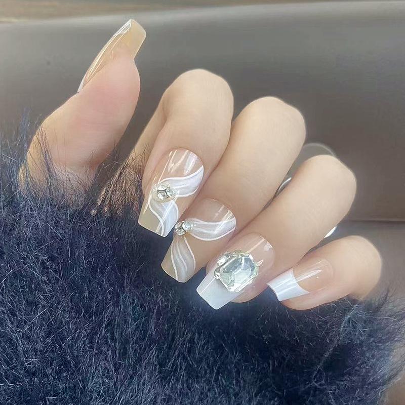 Shimmer Nude Ribbon French Manicure Rhinestone Short Ballerina Press-On Nails Glue Model
Shimmer Nude Ribbon French Manicure Rhinestone Short Ballerina Press-On Nails Glue Model