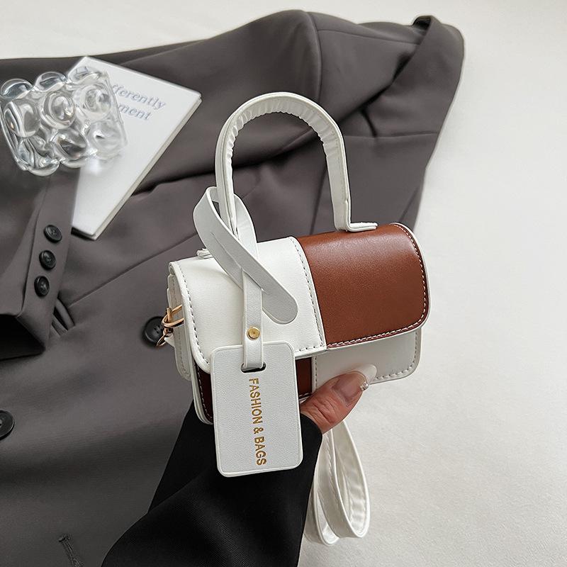 Niche design splicing contrasting color portable small square bag women s new temperament fashionable shoulder messenger bag коричневий
Niche design splicing contrasting color portable small square bag women s new temperament fashionable shoulder messenger bag коричневий