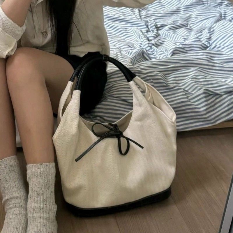 Korean Small-Logo Canvas Tote Bag for Women - Stylish Commuter Handbag, Versatile Shoulder/Underarm Crossbody Bag
Korean Small-Logo Canvas Tote Bag for Women - Stylish Commuter Handbag, Versatile Shoulder/Underarm Crossbody Bag