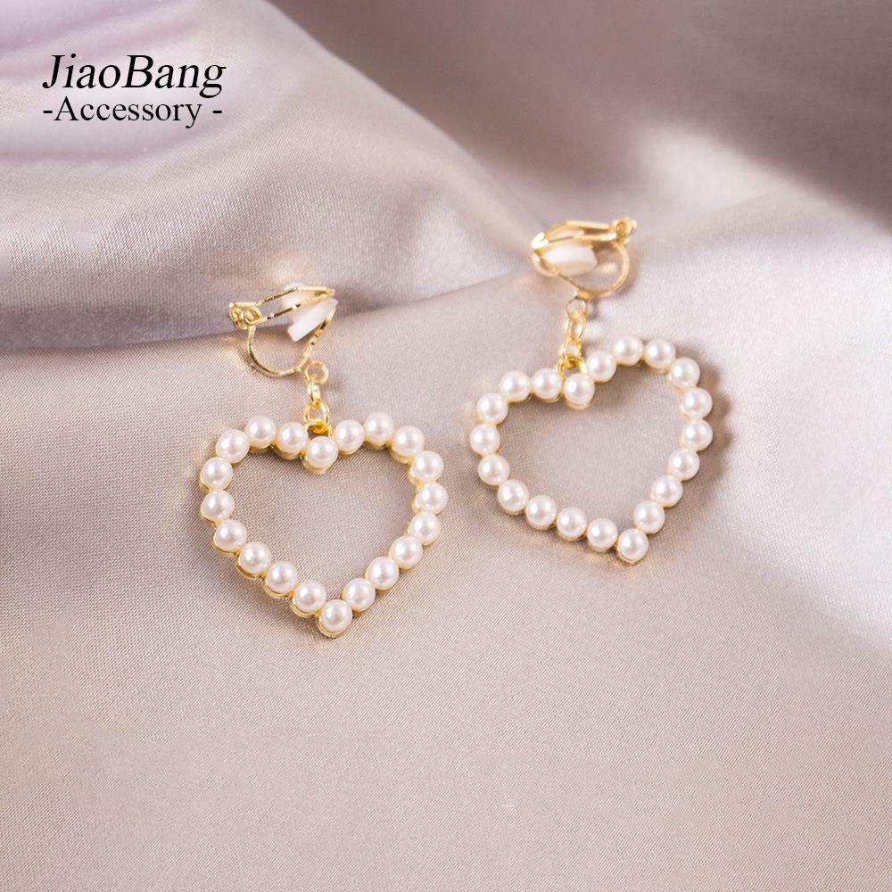 Elegant Pearl Heart and Triangle Ear Clips - No Piercing Needed, Trendy and Versatile Earrings for Women
Elegant Pearl Heart and Triangle Ear Clips - No Piercing Needed, Trendy and Versatile Earrings for Women