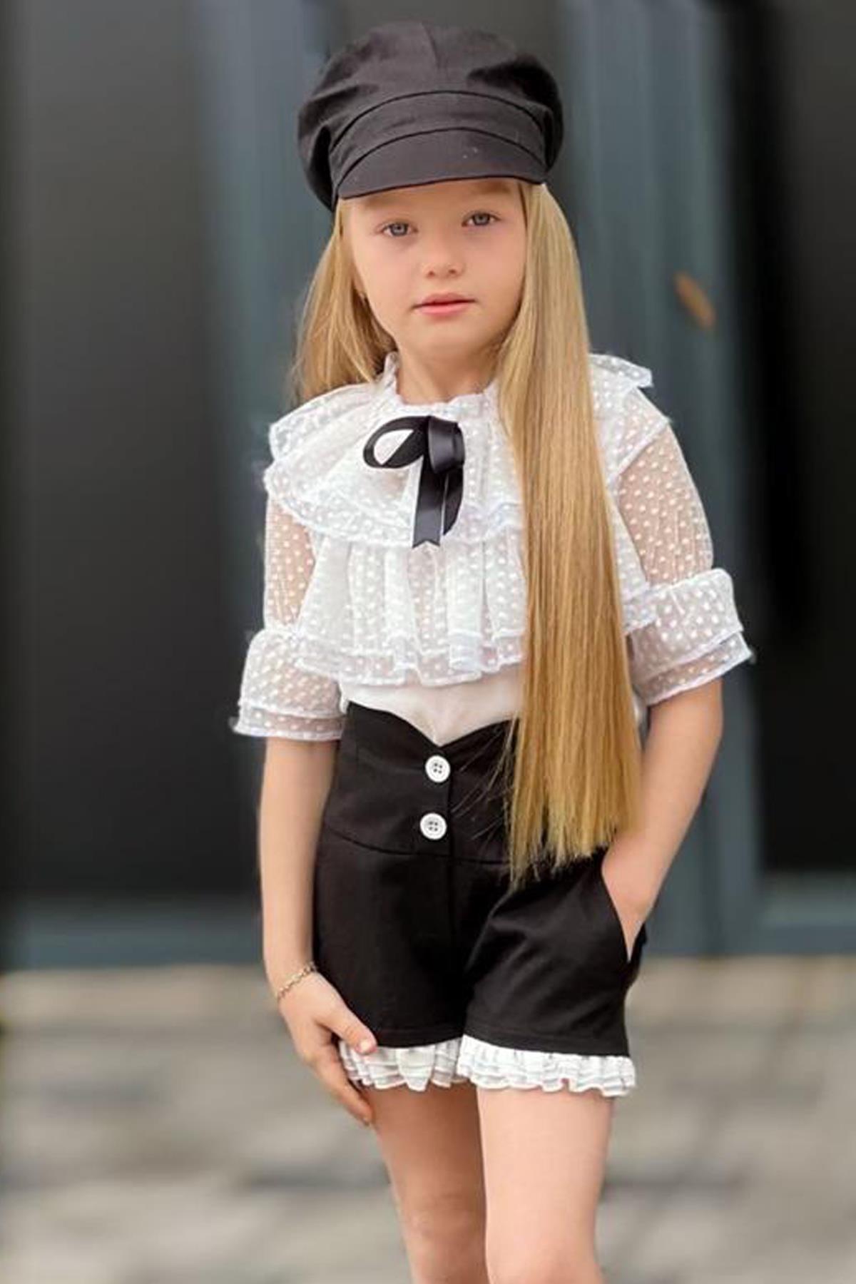 Комплект шифоновых черных шорт с воротником в горошек и оборками для девочек
Комплект шифоновых черных шорт с воротником в горошек и оборками для девочек