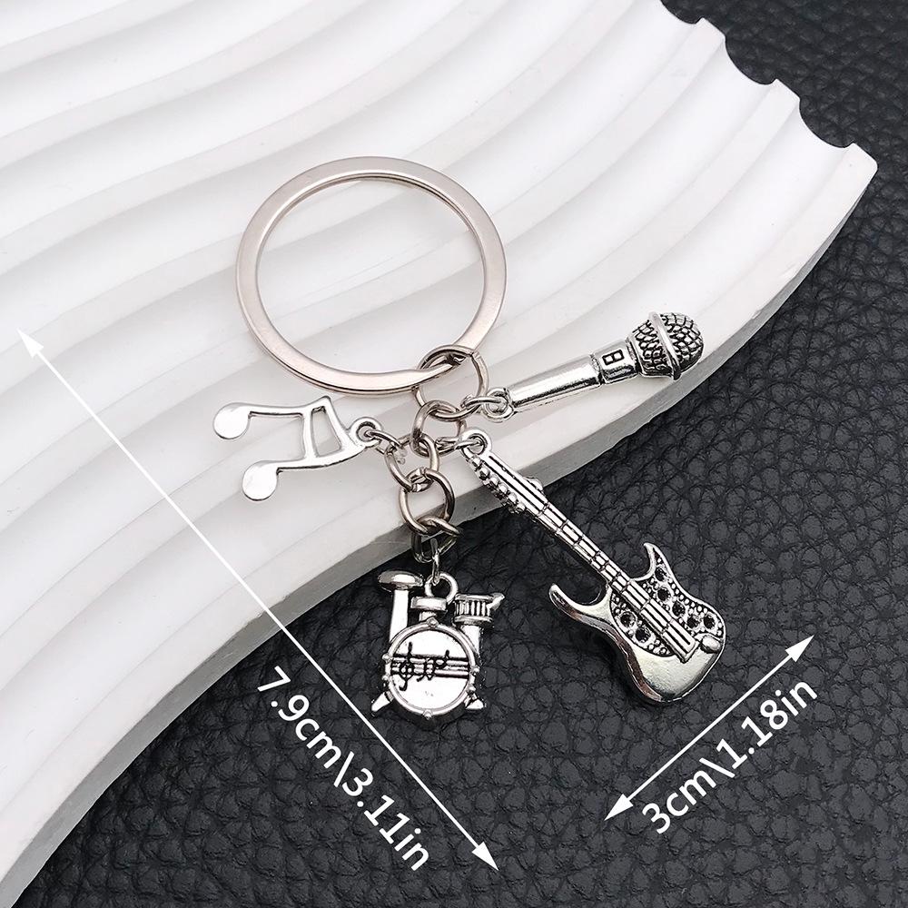 Vintage Silver Music Stand & Instruments Keychain Pendant for Music Lovers
Vintage Silver Music Stand & Instruments Keychain Pendant for Music Lovers