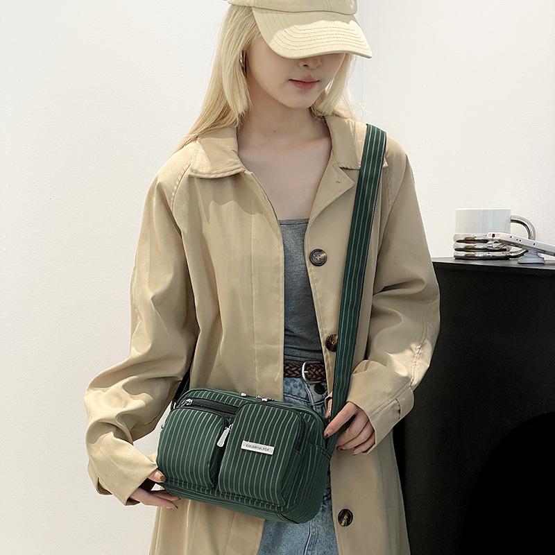 Original new anti-splashing camera bag diagonal span bag striped men s and women s shoulder bag
Original new anti-splashing camera bag diagonal span bag striped men s and women s shoulder bag