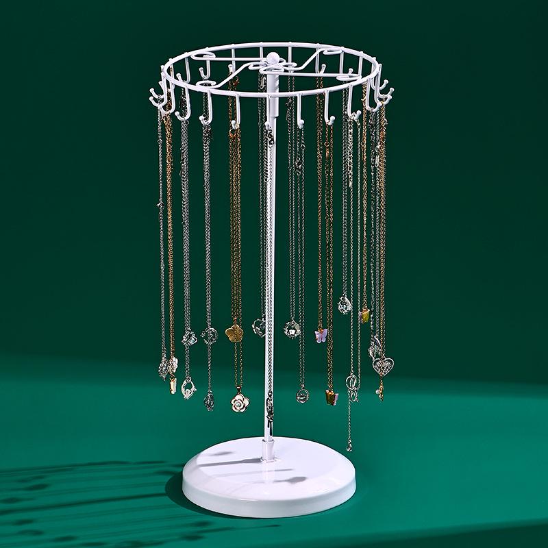 Rotating Jewelry Display Stand: 23-Hook Wrought Iron Rack for Necklaces and Bracelets, Detachable Board for Market Stall.
Rotating Jewelry Display Stand: 23-Hook Wrought Iron Rack for Necklaces and Bracelets, Detachable Board for Market Stall.