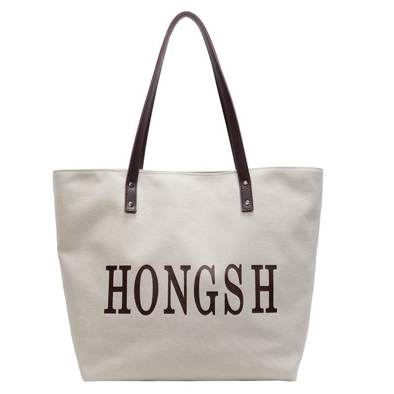 New washed canvas shoulder bag large capacity simple letter tote bag women s class work bag
New washed canvas shoulder bag large capacity simple letter tote bag women s class work bag