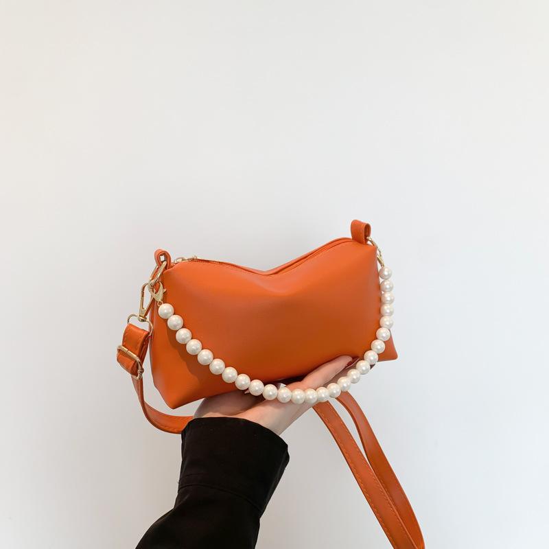 Однотонная текстура, простая и модная жемчужная цепочка, маленькая женская сумка на весну и лето, нишевый дизайн, модная маленькая квадратная сумка через плечо
Однотонная текстура, простая и модная жемчужная цепочка, маленькая женская сумка на весну и лето, нишевый дизайн, модная маленькая квадратная сумка через плечо