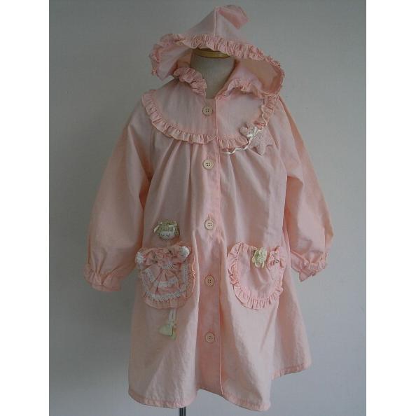 Raincoat (pink background with girl appliqu on the pocket)
Raincoat (pink background with girl appliqu on the pocket)