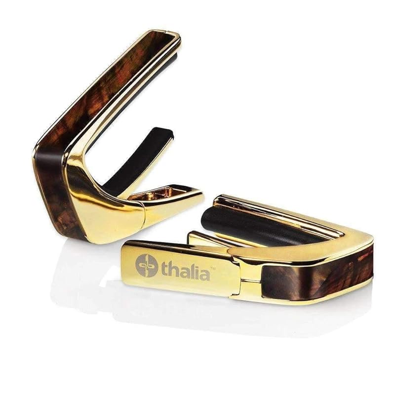 Thalia capo Thalia Capos Exotic Shell Series/WHISKY ANGEL WING capo tasto guitar 12 inch fred pad included (24K GOLD/WHISKY WING)
Thalia capo Thalia Capos Exotic Shell Series/WHISKY ANGEL WING capo tasto guitar 12 inch fred pad included (24K GOLD/WHISKY WING)