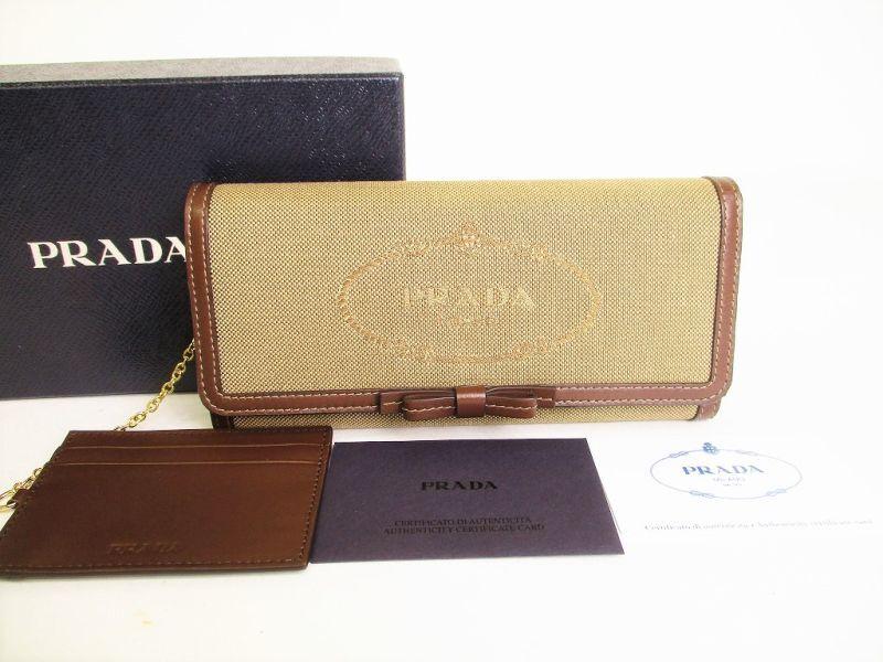Автентичний довгий гаманець PRADA з жаккардовим бежевим полотном і коричневою шкірою з клапаном №9025 відремонтований
Автентичний довгий гаманець PRADA з жаккардовим бежевим полотном і коричневою шкірою з клапаном №9025 відремонтований