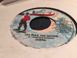 7-дюймовая пластинка ZEBRA - Jah Rule The Nation RJ030 Raggedy Joe Rec 1999 Ямайка Регги, Ска и Даб Б/У
7-дюймовая пластинка ZEBRA - Jah Rule The Nation RJ030 Raggedy Joe Rec 1999 Ямайка Регги, Ска и Даб Б/У