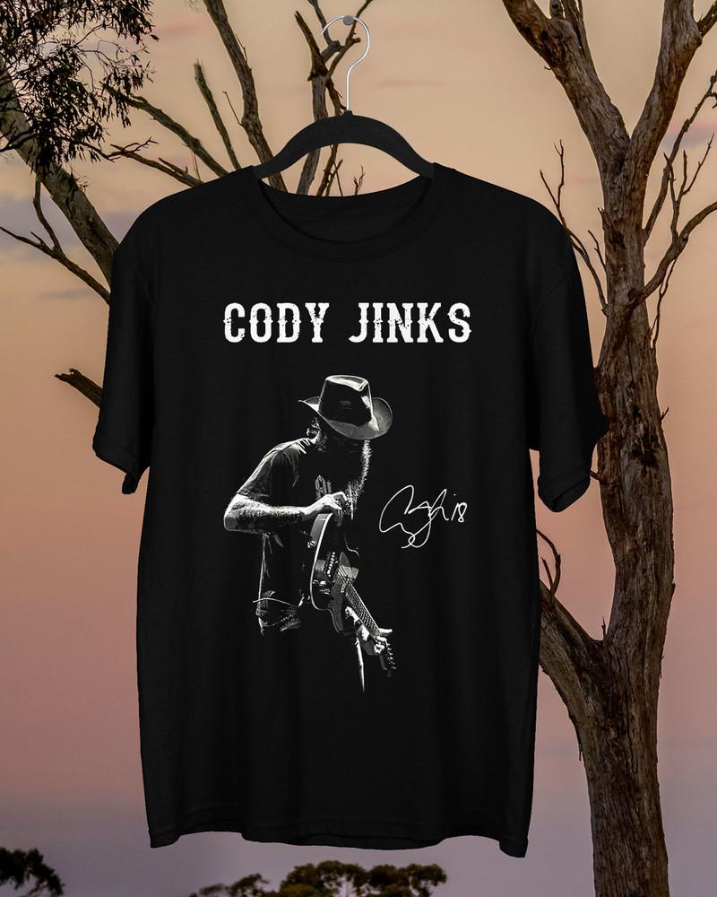 Signature CODY JINKS Red Rocks Shirt Classic Black Unisex S-5XL Unisex T-Shirt XL
Signature CODY JINKS Red Rocks Shirt Classic Black Unisex S-5XL Unisex T-Shirt XL