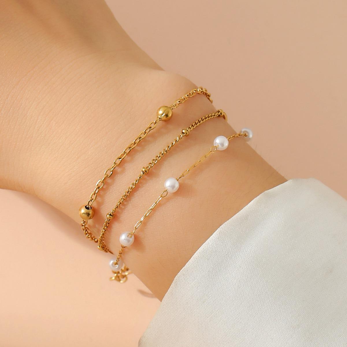 18k Gold Triple-Layer Bracelet with Imitation Pearl and Stainless Steel Beads - Women s Jewelry Exclusive
18k Gold Triple-Layer Bracelet with Imitation Pearl and Stainless Steel Beads - Women s Jewelry Exclusive
